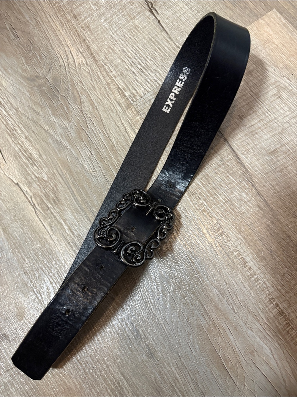 Express Black Leather Belt with Ornate Scroll Buckle